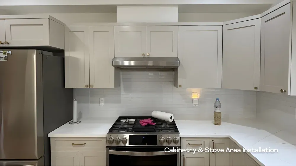 Custom light grey cabinetry and modern stainless steel gas stove installed during a Langley kitchen remodel by PCC.