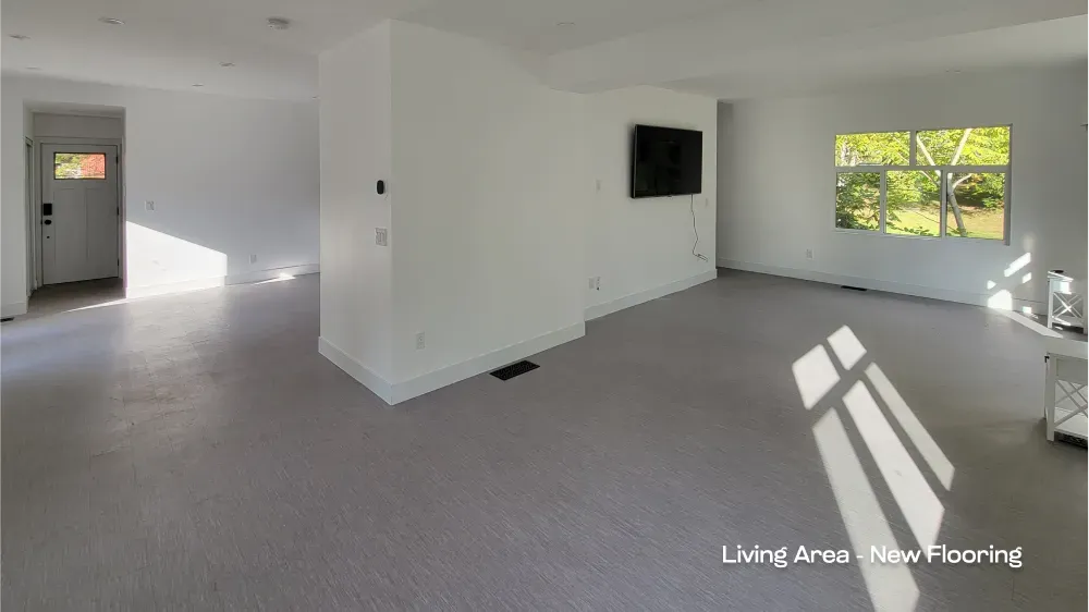 Brightly lit, new floor installation modern room by PCC. — after