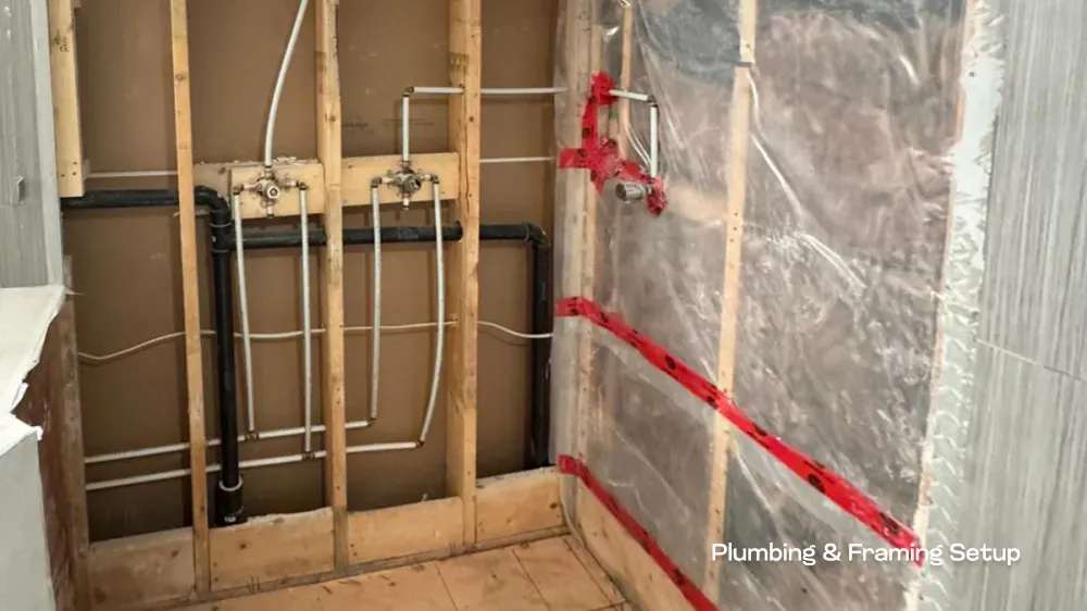 Rough-in plumbing and structural wall framing for a multi-fixture shower system, expertly installed by Pacific Coast Contracting